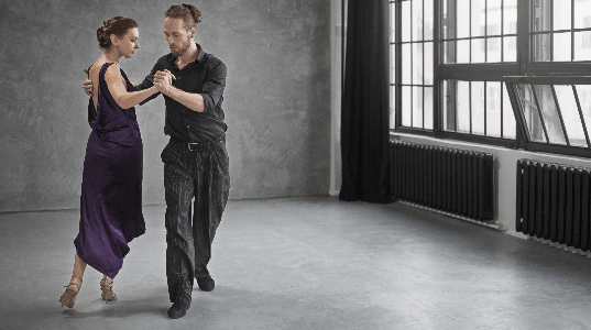 young people dancing tango studio