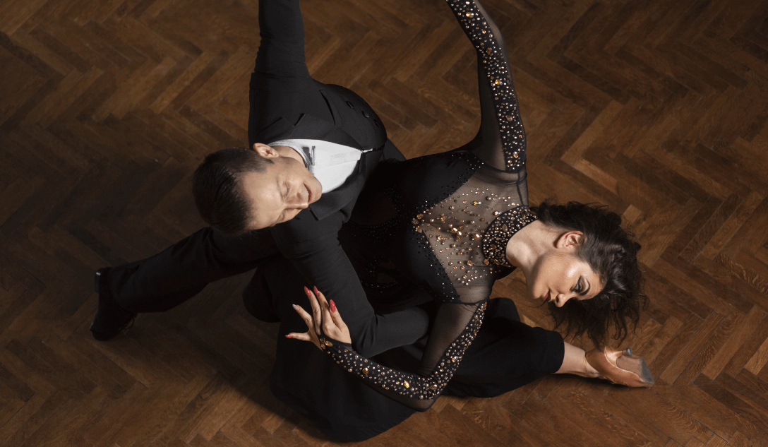 man woman showing ballroom dancing together