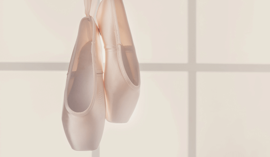 pink ballet pointe shoes hanging on window 2022 12 16 08 15 38 utc